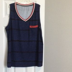 Polyester tank top. Navy with red trim.